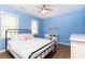 Bedroom with hardwood floors, blue walls, and desk at 511 Pine Springs Se Trl, Marietta, GA 30067