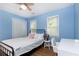 Bedroom with hardwood floors, blue walls, and closet at 511 Pine Springs Se Trl, Marietta, GA 30067