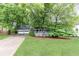 Charming home with well-maintained lawn, a two-car garage, and inviting front porch at 511 Pine Springs Se Trl, Marietta, GA 30067