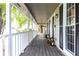 Charming front porch with rocking chairs and black shutters at 511 Pine Springs Se Trl, Marietta, GA 30067