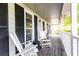 Charming front porch with rocking chairs and black shutters at 511 Pine Springs Se Trl, Marietta, GA 30067