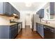 Updated kitchen featuring granite countertops, stainless steel appliances, and ample cabinet space at 511 Pine Springs Se Trl, Marietta, GA 30067