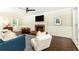Cozy living room with hardwood floors, fireplace, and modern furnishings at 511 Pine Springs Se Trl, Marietta, GA 30067