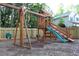 Backyard play area featuring a wooden swing set and slide at 1132 Britley Park Ln Ln, Woodstock, GA 30189