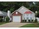 Charming home showcasing a well-manicured lawn, brick accents and a bay window at 1132 Britley Park Ln Ln, Woodstock, GA 30189