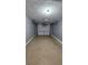 Empty one car garage with gray walls and a concrete floor at 1132 Britley Park Ln Ln, Woodstock, GA 30189