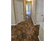 Hallway with tile flooring connecting multiple rooms at 1132 Britley Park Ln Ln, Woodstock, GA 30189