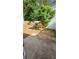 Back patio featuring mature landscaping, with a view to the yard and trees at 1132 Britley Park Ln Ln, Woodstock, GA 30189