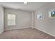 Comfortable bedroom with two windows and soft carpeting at 122 Grove View Rd, Woodstock, GA 30189