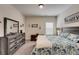 Bedroom featuring a large bed, a gray dresser, and decor on the walls at 122 Grove View Rd, Woodstock, GA 30189