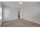 Neutral bedroom with carpet, base molding, and natural light from the window, offering a blank canvas at 122 Grove View Rd, Woodstock, GA 30189