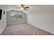 Bonus room with carpeted floors, high ceilings, and large windows to provide ample lighting at 122 Grove View Rd, Woodstock, GA 30189