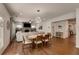 Open concept home with combined living and dining area with lots of natural light and hardwood flooring at 122 Grove View Rd, Woodstock, GA 30189