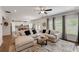 Spacious living room with an open floor plan, featuring a comfortable sectional sofa and bright, airy ambiance at 122 Grove View Rd, Woodstock, GA 30189
