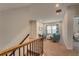 Cozy sitting area features comfortable armchairs, neutral carpet, and plenty of natural light at 122 Grove View Rd, Woodstock, GA 30189