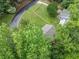 Aerial view of the house surrounded by lush greenery, offering a sense of privacy and seclusion at 3310 Southlake Ln, Cumming, GA 30041