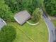Aerial view of home with a manicured lawn and well-maintained landscaping at 3310 Southlake Ln, Cumming, GA 30041
