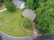 Bird's eye view of a home with a spacious yard, mature trees, and a well-kept lawn at 3310 Southlake Ln, Cumming, GA 30041