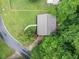 Aerial view of charming home featuring a manicured lawn and mature trees at 3310 Southlake Ln, Cumming, GA 30041
