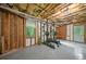 Basement with wood framing and an exterior window and door perfect for home gym at 3310 Southlake Ln, Cumming, GA 30041