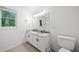 Bathroom with granite countertops, double sinks, and updated fixtures at 3310 Southlake Ln, Cumming, GA 30041