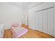 Cozy bedroom with wood floors, closet, and bright white walls at 3310 Southlake Ln, Cumming, GA 30041
