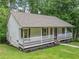 Charming single-story home featuring a classic front porch and landscaped yard at 3310 Southlake Ln, Cumming, GA 30041