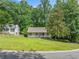 Charming single-story home with a covered front porch and a neatly manicured lawn at 3310 Southlake Ln, Cumming, GA 30041