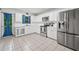 Modern kitchen featuring stainless steel appliances, white cabinets, and ample counter space at 3310 Southlake Ln, Cumming, GA 30041