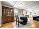 Dining area with dark wood table and chairs next to a china cabinet at 4067 Lenora Church Rd, Snellville, GA 30039