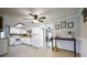 Spacious kitchen with white cabinets, stainless steel appliances, and ample counter space at 4067 Lenora Church Rd, Snellville, GA 30039