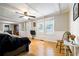 Bright living room with hardwood floors, white trim, and neutral wall paint at 4067 Lenora Church Rd, Snellville, GA 30039