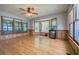 Bright, light-filled living room with hardwood floors, wood trim, and large windows at 4067 Lenora Church Rd, Snellville, GA 30039