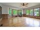 Spacious room with hardwood floors, wood trim, and plenty of natural light from large windows at 4067 Lenora Church Rd, Snellville, GA 30039