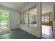Sun room with lots of windows, wood floors and an exit to the backyard at 4067 Lenora Church Rd, Snellville, GA 30039