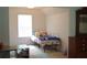 Bright bedroom with a bed, and window, ideal for relaxation at 4450 Ivy Fork Dr, Loganville, GA 30052