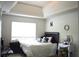 Bedroom with king size bed and tray ceilings at 4450 Ivy Fork Dr, Loganville, GA 30052