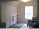 Well-lit bedroom features a large window, bed, and plenty of space at 4450 Ivy Fork Dr, Loganville, GA 30052