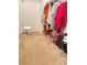 Walk-in closet featuring plenty of storage with colorful clothes at 4450 Ivy Fork Dr, Loganville, GA 30052