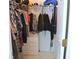 This is a reach-in closet with clothes racks, shelves, and storage drawers at 4450 Ivy Fork Dr, Loganville, GA 30052