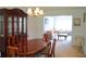 Elegant dining room featuring wood furniture, a chandelier, and a large china cabinet at 4450 Ivy Fork Dr, Loganville, GA 30052