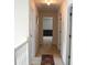 Inviting hallway with neutral carpet leads to various rooms, accented by overhead lighting at 4450 Ivy Fork Dr, Loganville, GA 30052