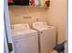 Laundry room with washer and dryer, and upper shelf storage at 4450 Ivy Fork Dr, Loganville, GA 30052