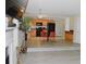 Open-concept with hardwood floor, connecting living and dining area to kitchen at 4450 Ivy Fork Dr, Loganville, GA 30052