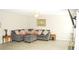 Spacious living room with large sectional sofa and neutral decor at 4450 Ivy Fork Dr, Loganville, GA 30052