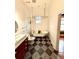 Bathroom features a freestanding tub, patterned tile floors, and modern fixtures at 549 Atwood Sw St, Atlanta, GA 30310