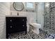 Modern bathroom featuring black and white patterned tiles, a vanity, and glass shower at 549 Atwood Sw St, Atlanta, GA 30310