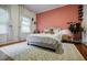 Bright bedroom featuring a comfortable bed, large windows, and a decorative accent wall at 549 Atwood Sw St, Atlanta, GA 30310