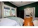 Bedroom with hardwood floors, windows, and view to another room at 549 Atwood Sw St, Atlanta, GA 30310