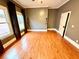 Bright bedroom with hardwood floors, large windows, and neutral paint at 549 Atwood Sw St, Atlanta, GA 30310